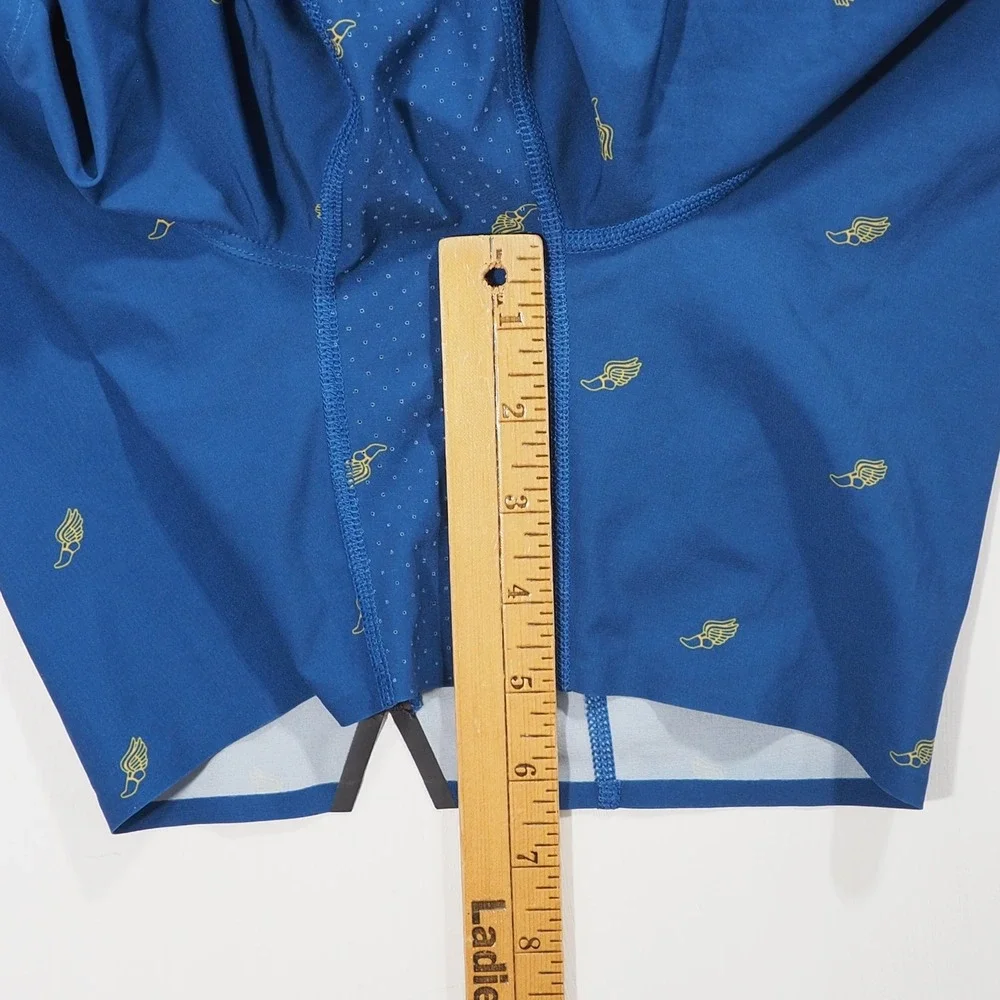 Rhone Swift Academy Shorts Men Medium Blue Winged Foot Print Lined Athletic Loop